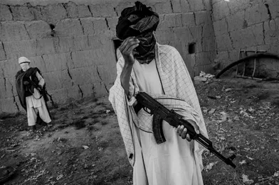  A member of Taliban covering his face from the photographer, Ghondouz city, North of Kabul 