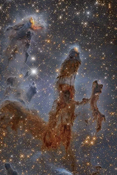 7 mars. Des nouvelles étoiles se forment dans la nébuleuse de l'Aigle. Ces colonnes sont formées de gaz et de poussière. La photo a été prise en infrarouge par le télescope Hubble et retouchée ensuite.