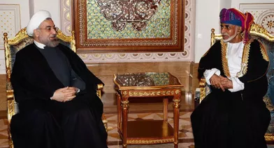 Le sultan Qaboos d'Oman avec le président iranien Hassan Rohani à Mascate, le 12 mars 2014