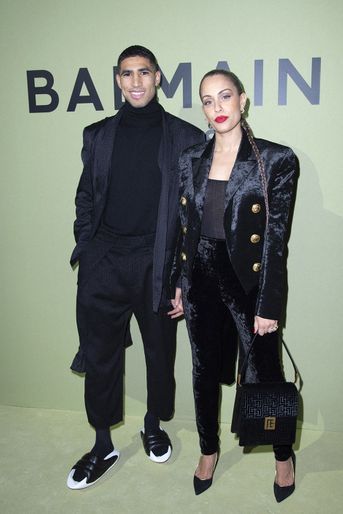Achraf Hakimi and Hiba Abouk au défile Balmain lors de la Fashion Week à Paris, le 2 mars 2022.