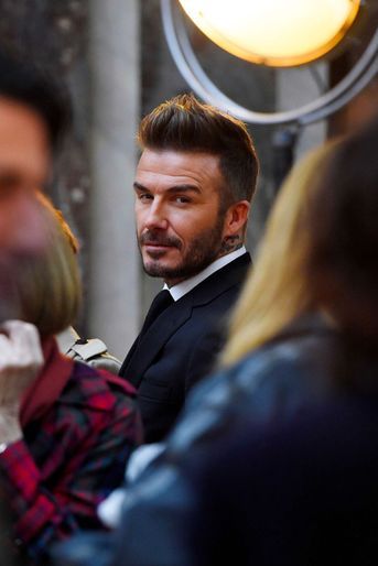 David Beckham au premier rang du défilé de sa femme pendant la Fashion Week