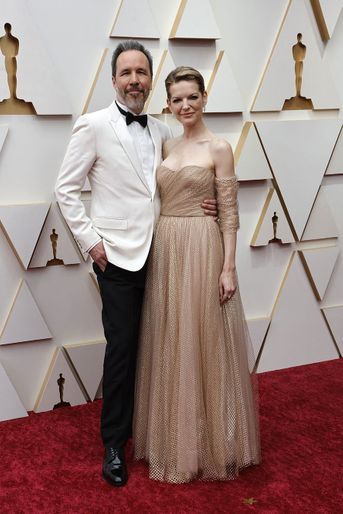 Denis Villeneuve et son épouse sur le tapis rouge des Oscars 2022.