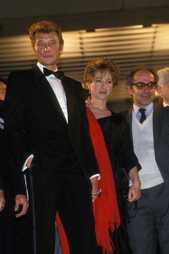Johnny Hallyday et Nathalie Baye auprès de Jean-Luc Godard pour le film «Détective» en 1985.