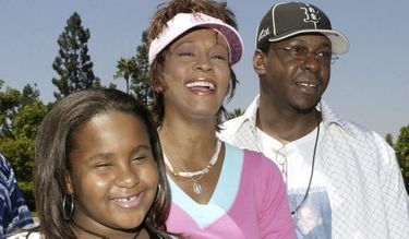 Avec son mari Bobby Brown et leur fille Bobbi -