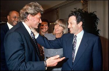 Johnny Hallyday et Michel Drucker lors de l'anniversaire de Jean-Paul Belmondo en 1993.