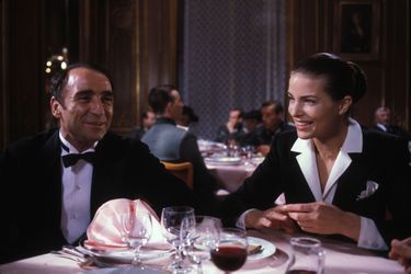 Claude Brasseur et Gudrun Landgrebe sur le tournage du film 'Palace' réalisé par Edouard Molinaro en 1984, France. 