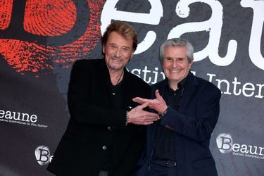 Johnny Hallyday et Claude Lelouch lors de la soirée d'ouverture du 6ème Festival International du Film Policier de Beaune avec un hommage à Johnny Hallyday pour l'ensemble de sa carrière cinématographique, le 2 avril 2014. 