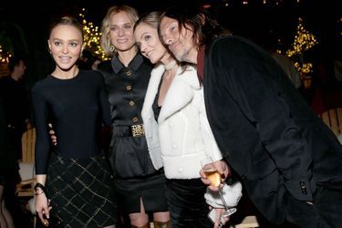 Lily-Rose Depp, Diane Kruger et son compagnon Norman Reedus lors de la soirée organisée par Chanel à New York le 10 décembre 2019. 