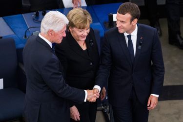 Bill Clinton, Angela Merkel et Emmanuel Macron