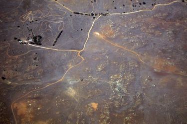 Tracks and roads can be seen near a farmhouse in drought-affected farming areas located in the eastern region of the state of South Australia