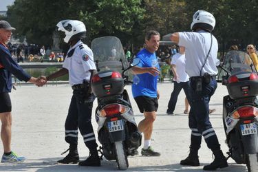 Nicolas Sarkozy : séance de jogging dans le parc des Tuileries le 10 septembre 2014