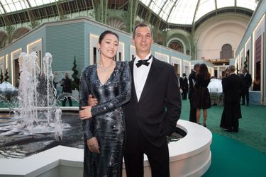 Gong Li et Philippe Leopold-Metzger, président de Piaget, au dîner de gala de la Biennale des antiquaires à Paris, le 8 septembre 2014.