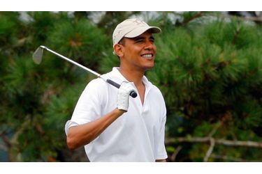 Barack Obama s&#039;est adonné avec joie à une partie de golf avec plusieurs partenaires dont le PDG de la banque suisse UBS, Robert Wolf.
