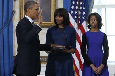Barack, Michelle et Malia Obama, en janvier 2013.