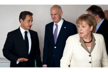 <br />
Nicolas Sarkozy, le Premier ministre grec Georges Papandreou et Angela Merkel
