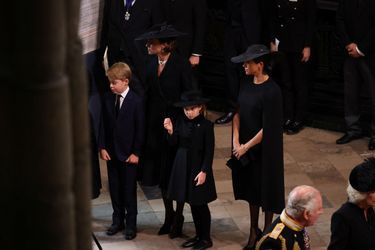 Le prince George, la princesse Charlotte, la princesse de Galles et la duchesse de Sussex. 