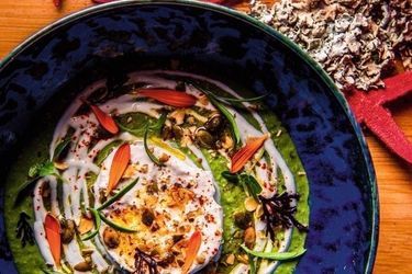 Cream of green asparagus with seaweed and aromatic herbs, feta and cashews.