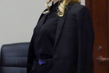 Amber Heard, 36, in court.  She is best known for playing a CIA agent in “3 Days to Kill”.  Inset, with his lawyers, April 18.