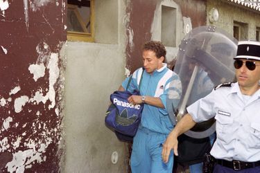 Olympique de Marseille player Jean-Pierre Papin, shortly before the north stand collapsed.  He will put his tracksuit jacket in a ball under the head of an injured person, Didier Grassi, commentator from Bastia on a local radio, who will become a member of the collective of victims.