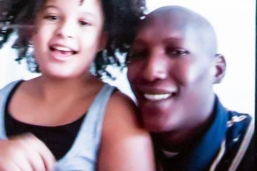 Pretin, 10, with her father. As a child, his parents separated.