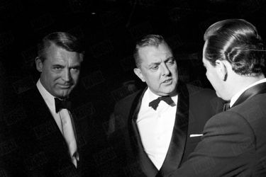 Jacques Tati with American actor Cary Grant at a gala dinner at the Chateau de Chancellor in Paris on May 29, 1959.