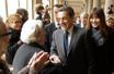<br />
Nicolas Sarkozy et Carla Bruni au bureau de vote du lycée Jean-de-La-Fontaine, dans le XVIe arrondissement, à Paris.